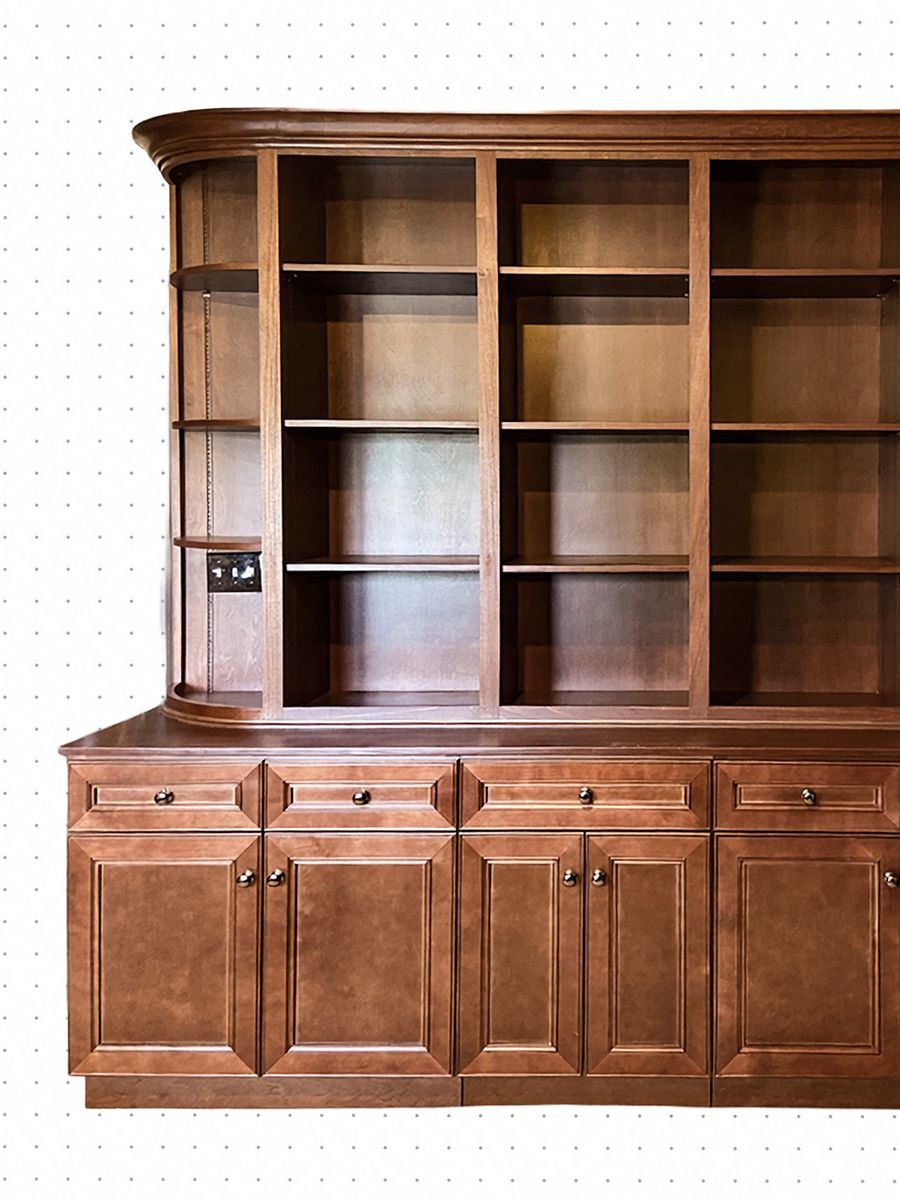 Built-in cherry bookcase and hutch with a curved end shelf